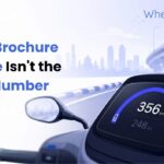 EV real world range versus brochure range comparison shown on a scooter dashboard.